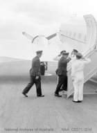 Air Commodore Garing OBE DFC and Group Captain Headlam entering aircraft at Essendon.jpg